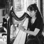 woman playing harp